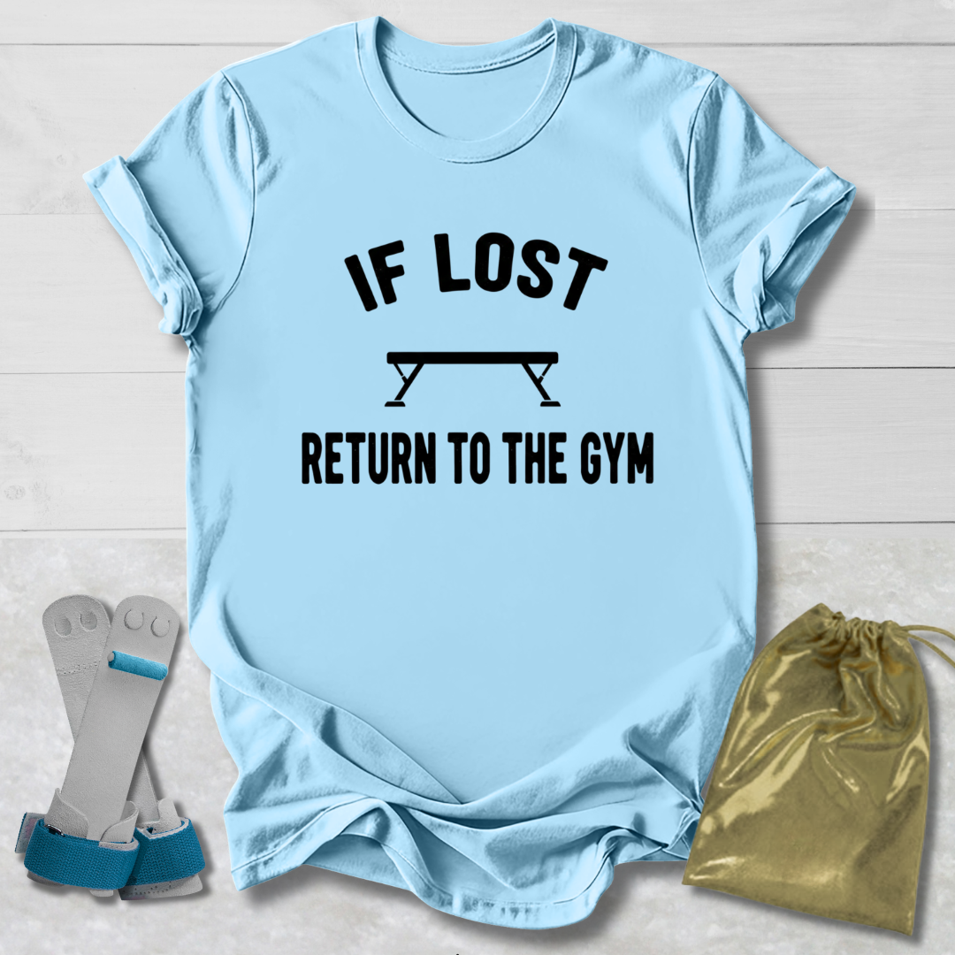 Light blue t-shirt with 'If lost, return to the gym' text, socks, and drawstring bag on a light wooden surface.