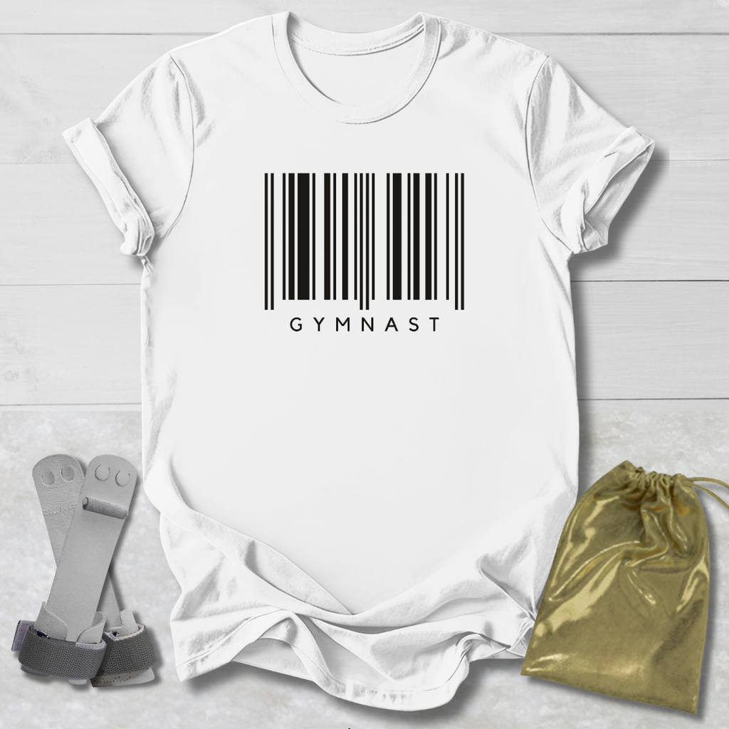 White t-shirt with barcode and 'GYMNAST' text, socks, and drawstring bag on a light wooden surface