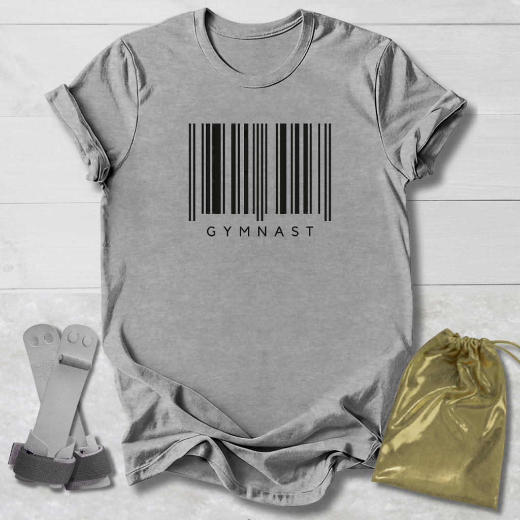Gray t-shirt with barcode and 'GYMNAST' text, socks, and drawstring bag on a light wooden surface