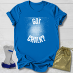 Blue t-shirt with 'GOT CHALK?' text, socks, and a drawstring bag on a light wooden surface.