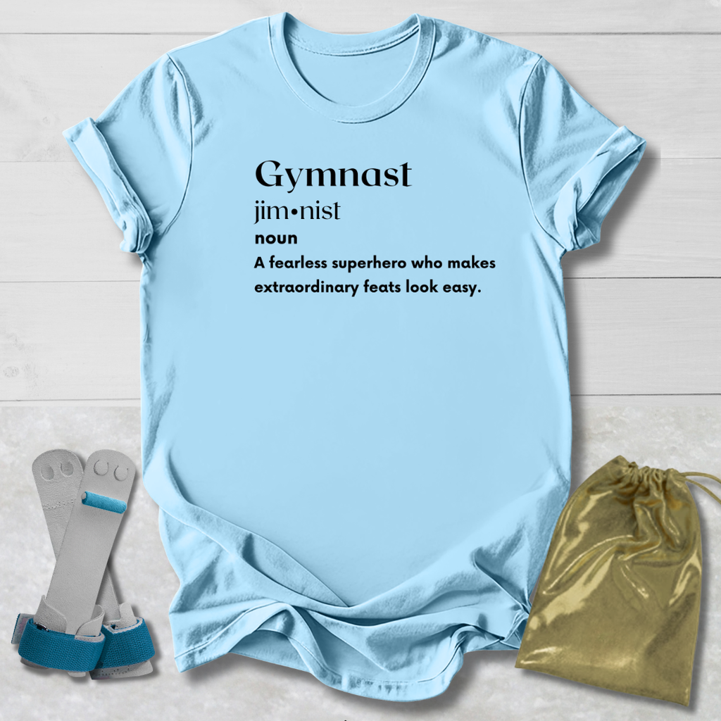 Light blue t-shirt with text, socks, and drawstring bag on a light wooden surface