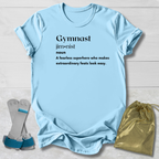 Light blue t-shirt with text, socks, and drawstring bag on a light wooden surface