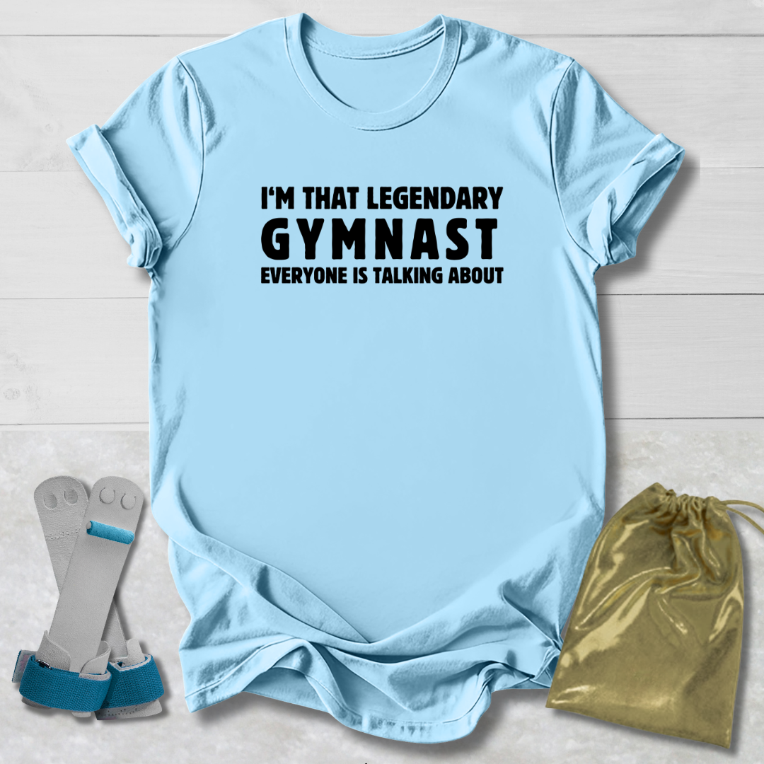 Light blue t-shirt with text, socks, and drawstring bag on a light wooden surface