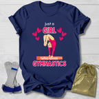 Navy blue t-shirt with gymnastics-themed Just a Girl Who Loves Gymnastics  design on a light wooden surface.