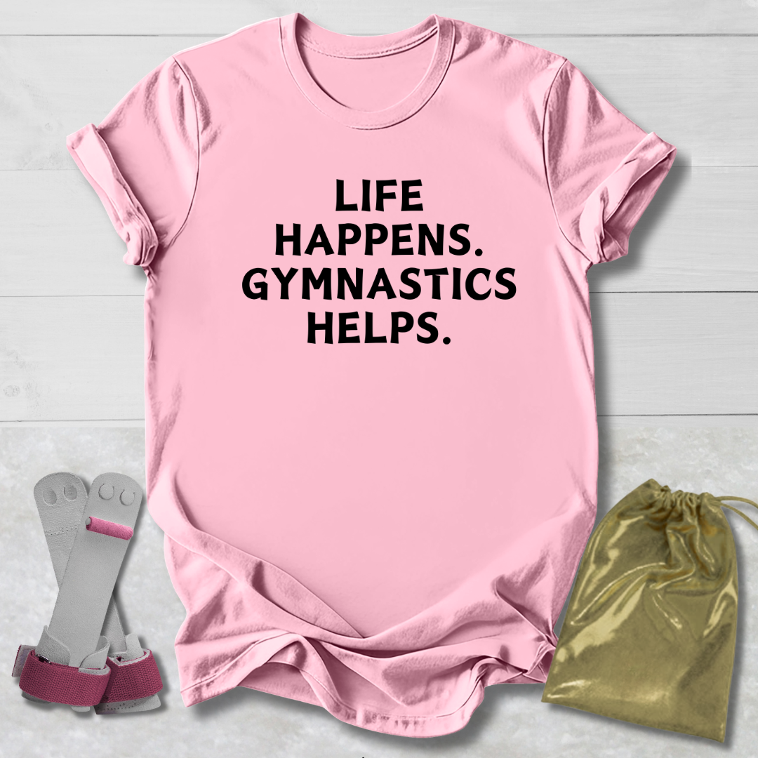 Pink t-shirt with 'Life happens. Gymnastics helps.' text, socks, and drawstring bag on a light gray background