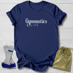 Navy blue t-shirt with 'Gymnastics Life' text, socks, and drawstring bag on a light wooden surface.