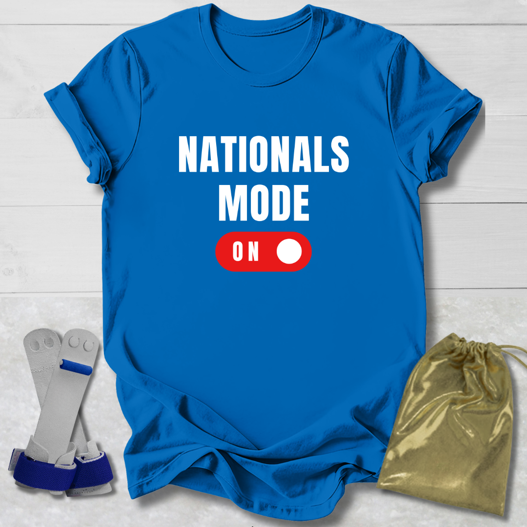 Blue t-shirt with 'NATIONALS MODE ON' text, socks, and drawstring bag on a light wooden surface