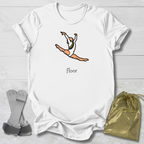 White t-shirt with a graphic of a gymnast and 'Floor' text, displayed with socks and a drawstring bag on a light wooden surface.