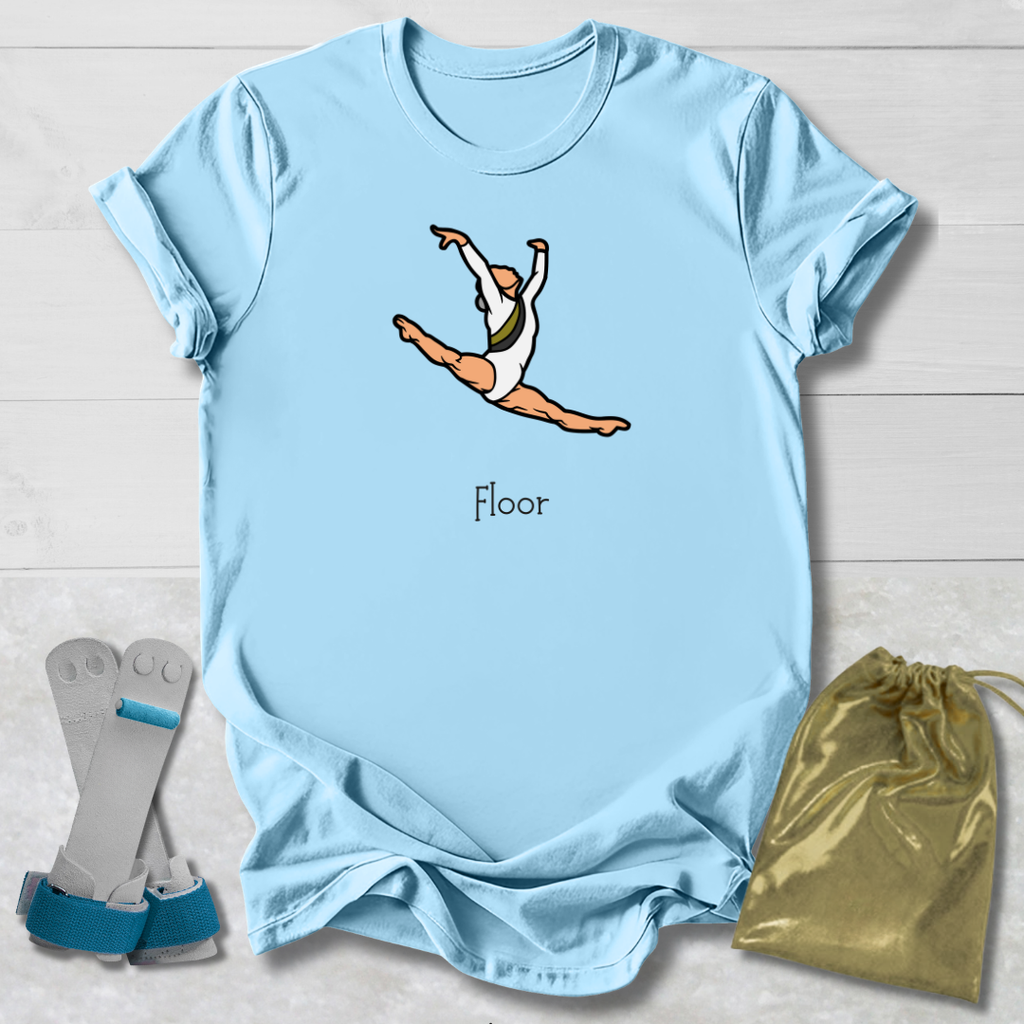 Light blue t-shirt with a graphic of a gymnast and the word 'Floor', displayed with socks and a drawstring bag on a light wooden surface.