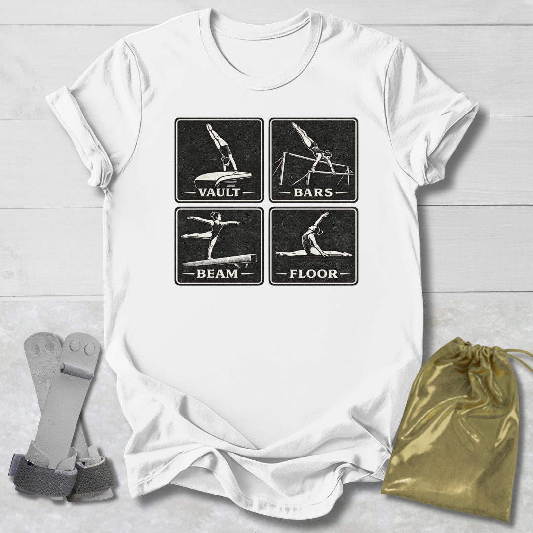 White t-shirt with gymnastics-themed graphic on a light wooden surface with socks and a drawstring bag.