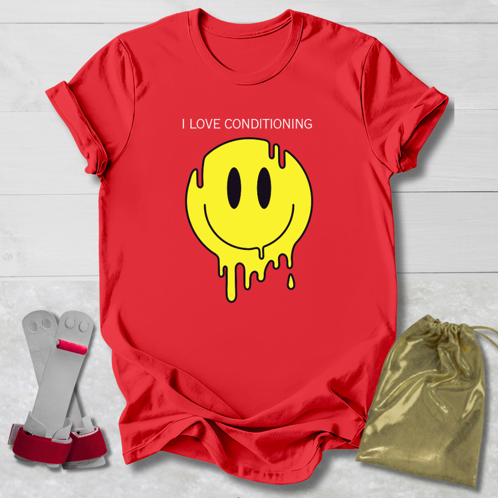 Red t-shirt with yellow smiley face graphic and text, socks, and drawstring bag on a light gray background