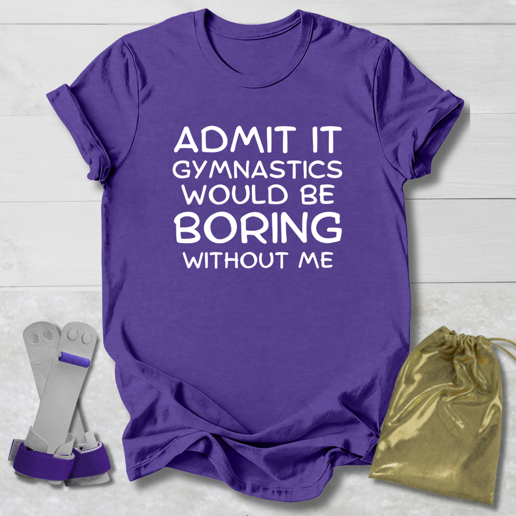 Purple t-shirt with text 'Admit it, gymnastics would be boring without me' on a wooden surface with accessories.