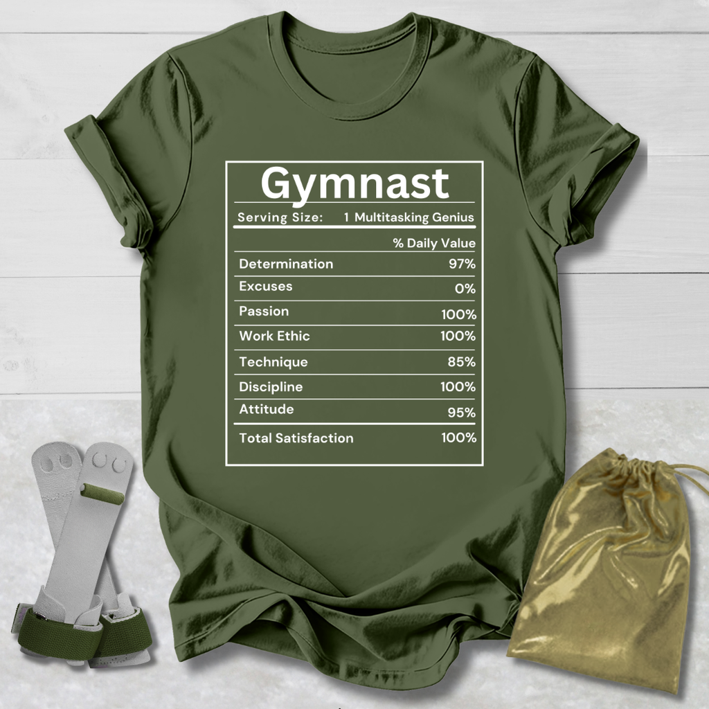 Green t-shirt with 'Gymnast' graphic on a wooden surface with socks and a drawstring bag.