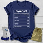 Navy blue t-shirt with 'Gymnast' graphic on a wooden surface with socks and a drawstring bag.