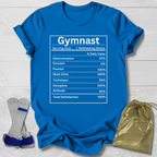 Blue t-shirt with 'Gymnast' nutrition graphic on a wooden surface with socks and a drawstring bag.