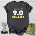 Maroon t-shirt with 'It's a gymnast thing (you wouldn't understand)' text, socks, and drawstring bag on a light wooden surface.
