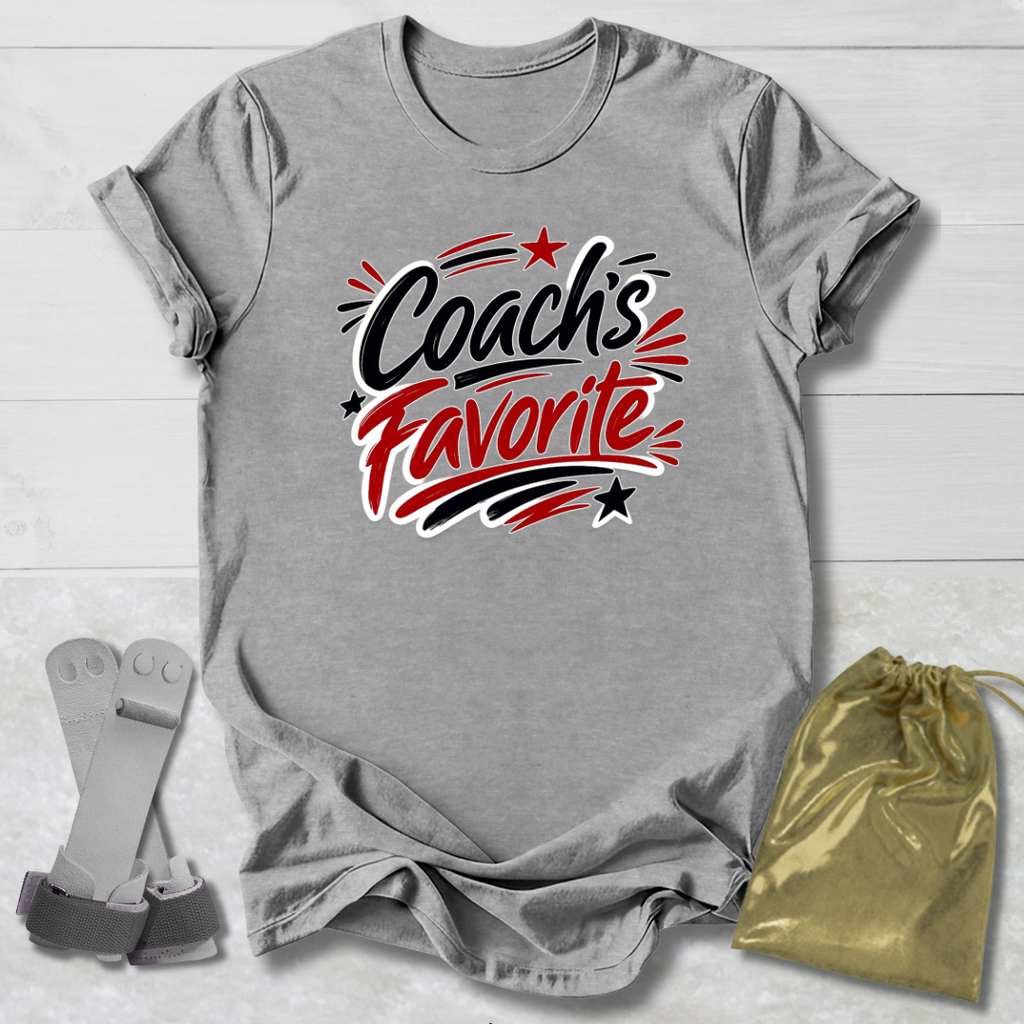Gray t-shirt with 'Coach's Favorite' text, socks, and drawstring bag on a light wooden surface