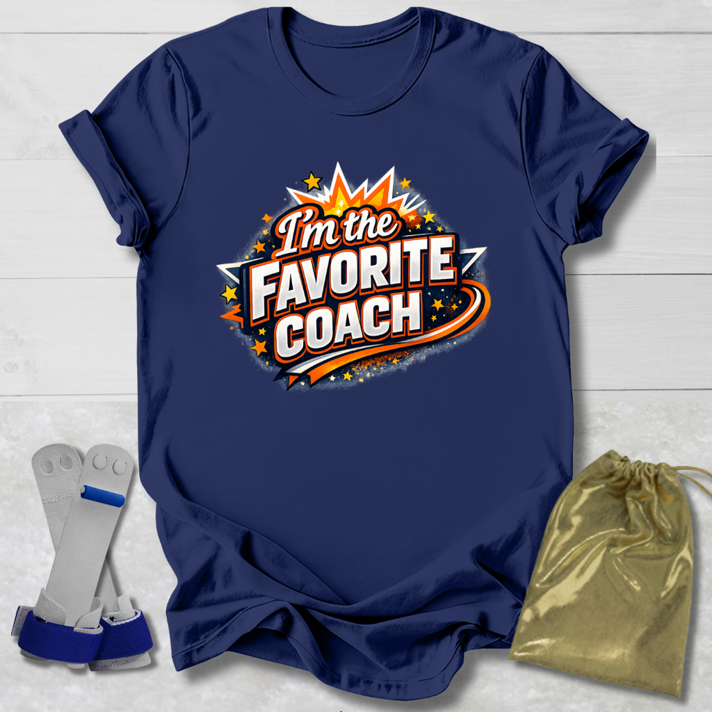 Navy blue t-shirt with 'I'm the Favorite Coach' design on a light wooden surface.