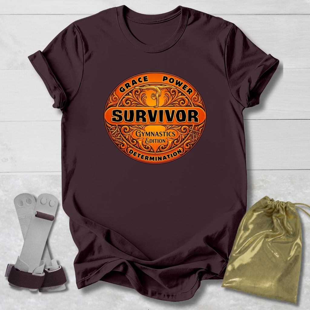 Brown t-shirt with 'Survivor' Gymnast Edition graphic design on a light wooden surface with socks and a drawstring bag.