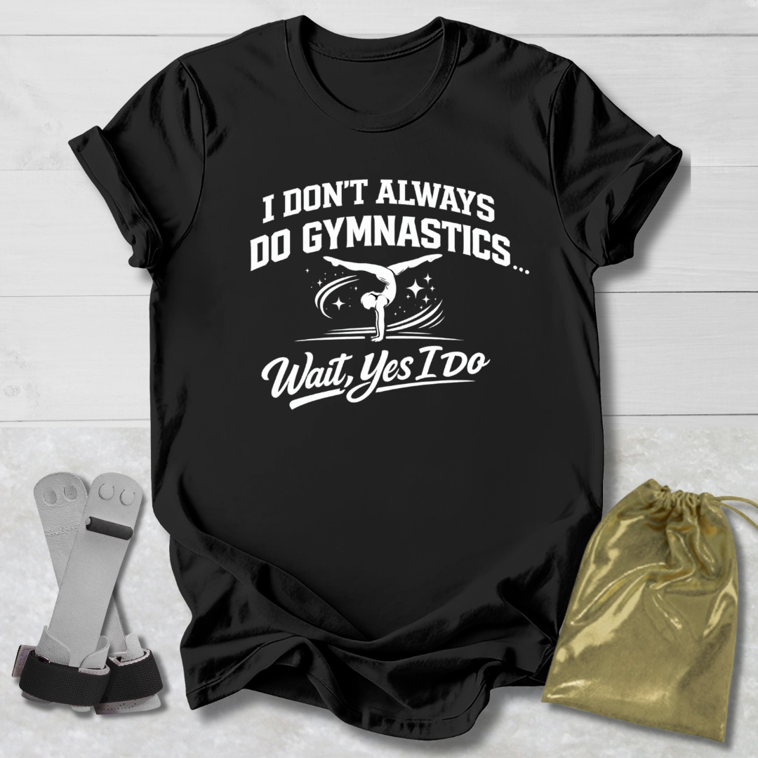 Black t-shirt with a humorous gymnastics graphic and I don't always do gymnastics . . . wait, yes I do text on a light wooden surface.
