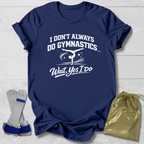 Navy blue t-shirt with white I don't always do gymnastics . . . wait, yes I do text and graphic, socks, and drawstring bag on a light wooden surface.