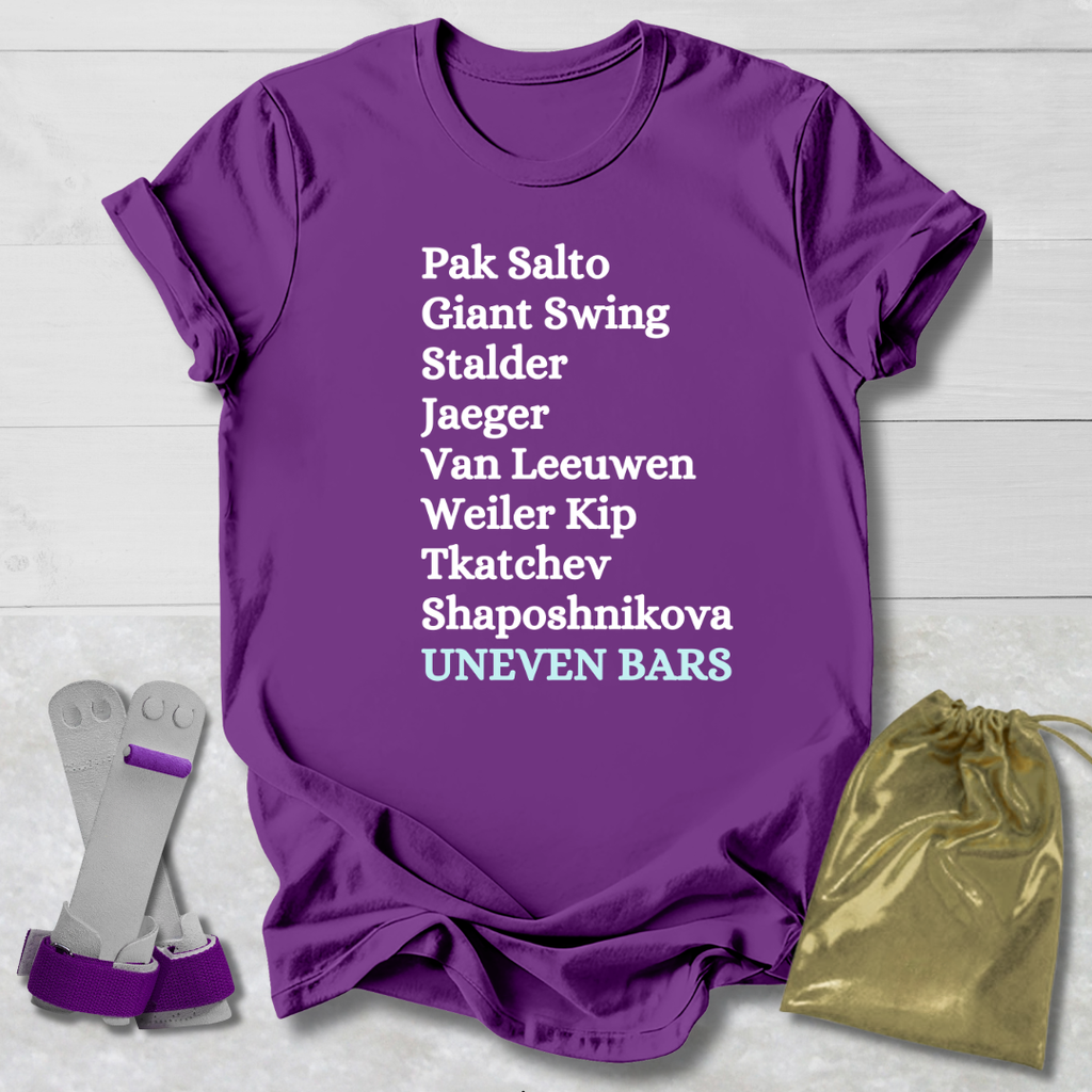 Purple t-shirt with gymnast uneven bars skills text, gray socks, and gold drawstring bag on a light wooden surface