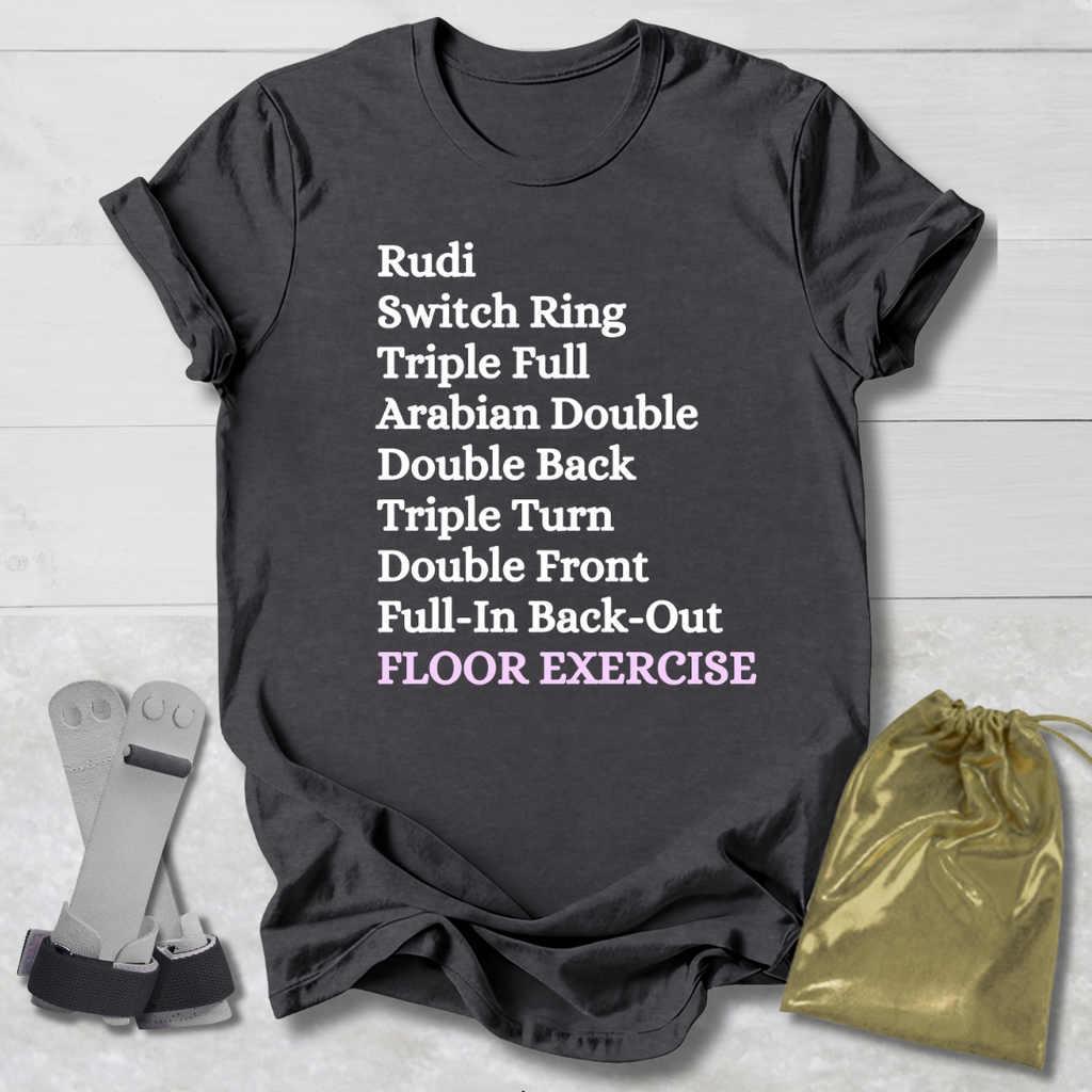 Dark gray t-shirt with floor exercise skills, socks, and drawstring bag on a light wooden surface