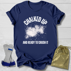 Navy blue t-shirt with 'Chalked Up and Ready to Crush It' text, socks, and drawstring bag on a light wooden surface.