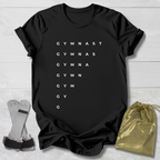 Black t-shirt with 'GYMNAST' text, socks, and drawstring bag on a light wooden surface