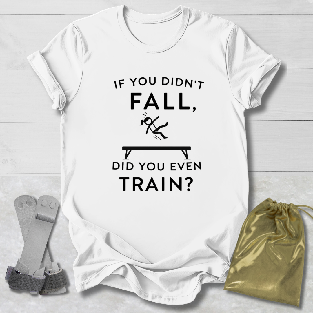 White t-shirt with humorous  gymnast text design on a light wooden surface with socks and a drawstring bag.