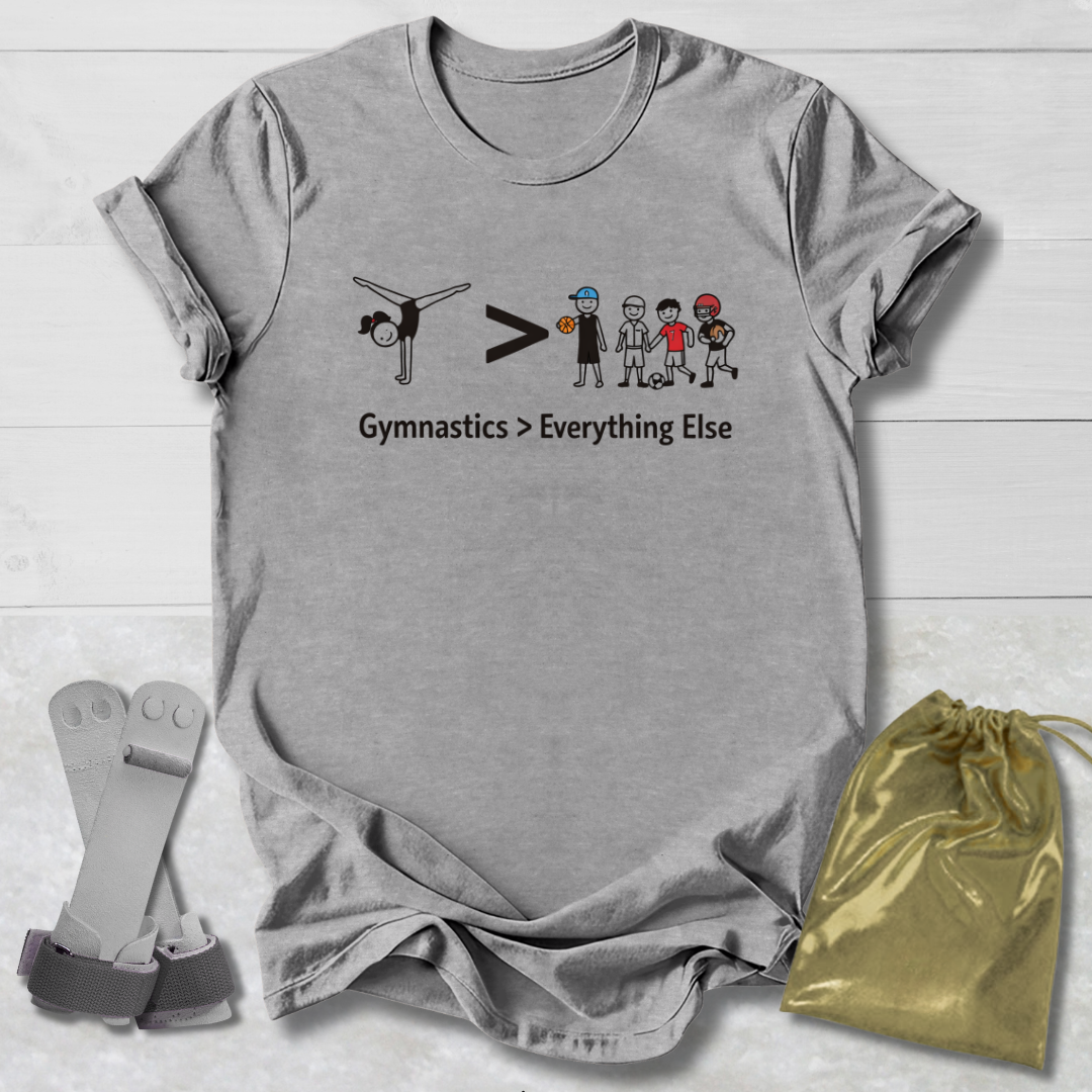 Gray t-shirt with gymnastics graphic and text, socks, and drawstring bag on a light wooden surface