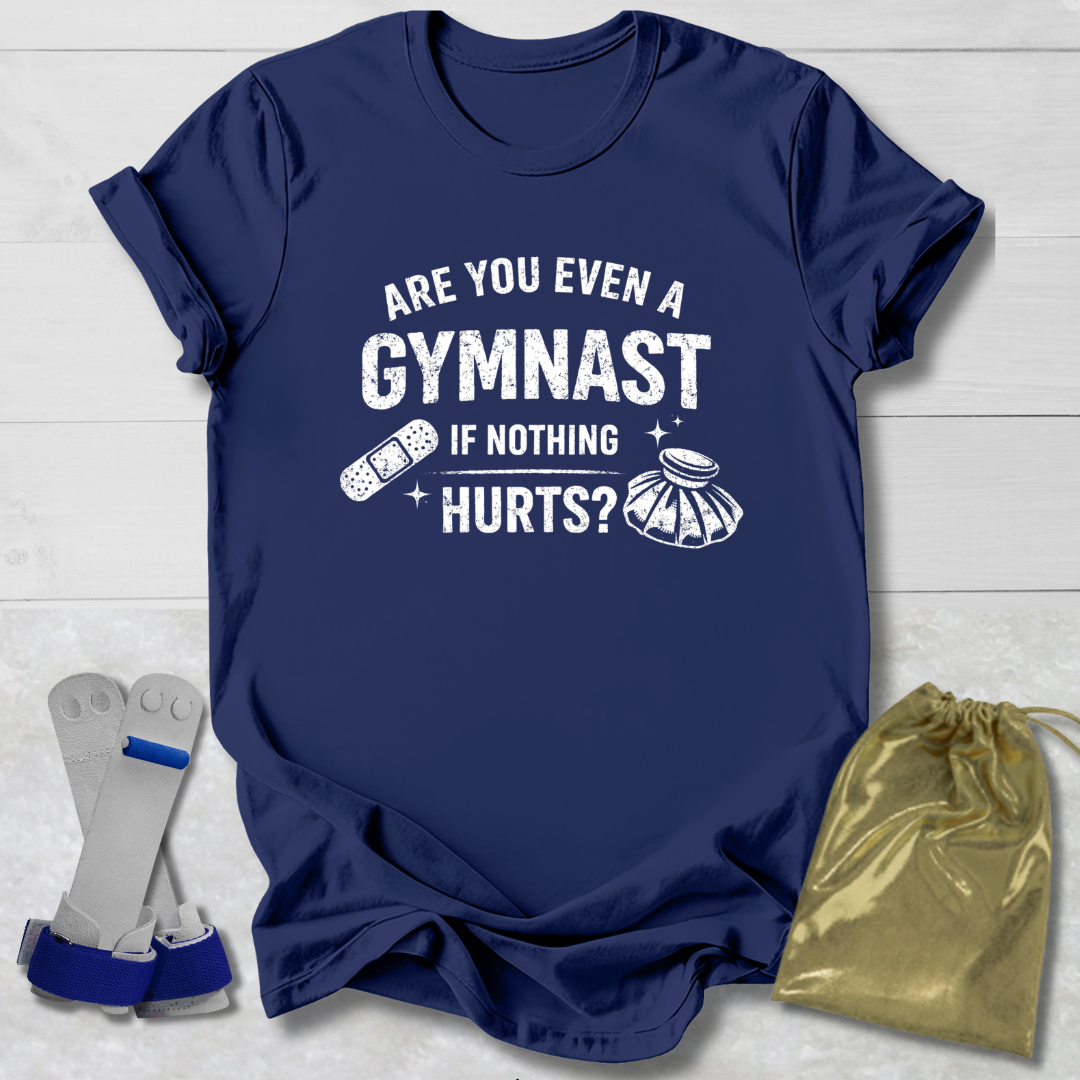 Navy blue t-shirt with humorous gymnast text, socks, and drawstring bag on a light wooden surface