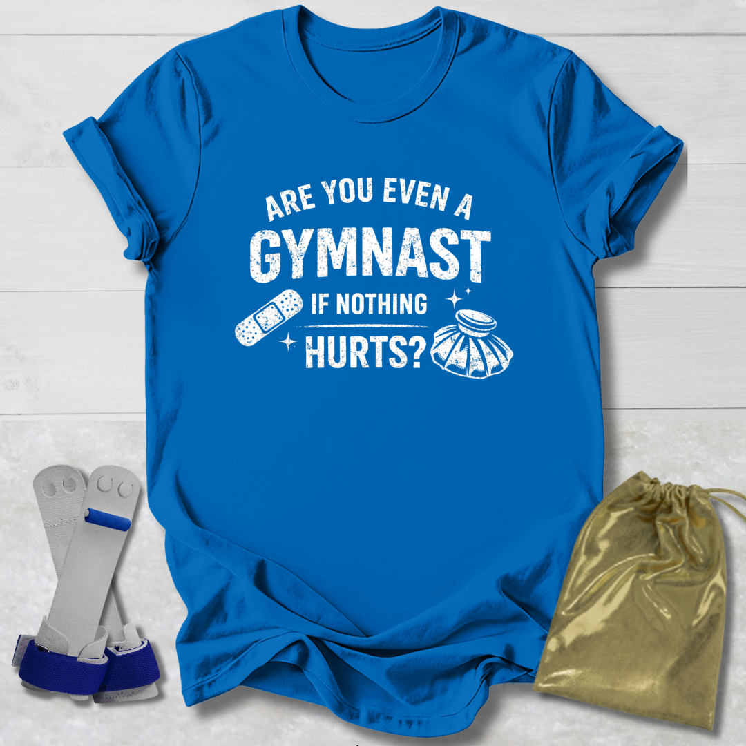 Blue t-shirt with humorous gymnast text, socks, and drawstring bag on a light wooden surface