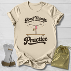 Beige t-shirt with motivational quote and graphic, socks, and drawstring bag on a light wooden surface.