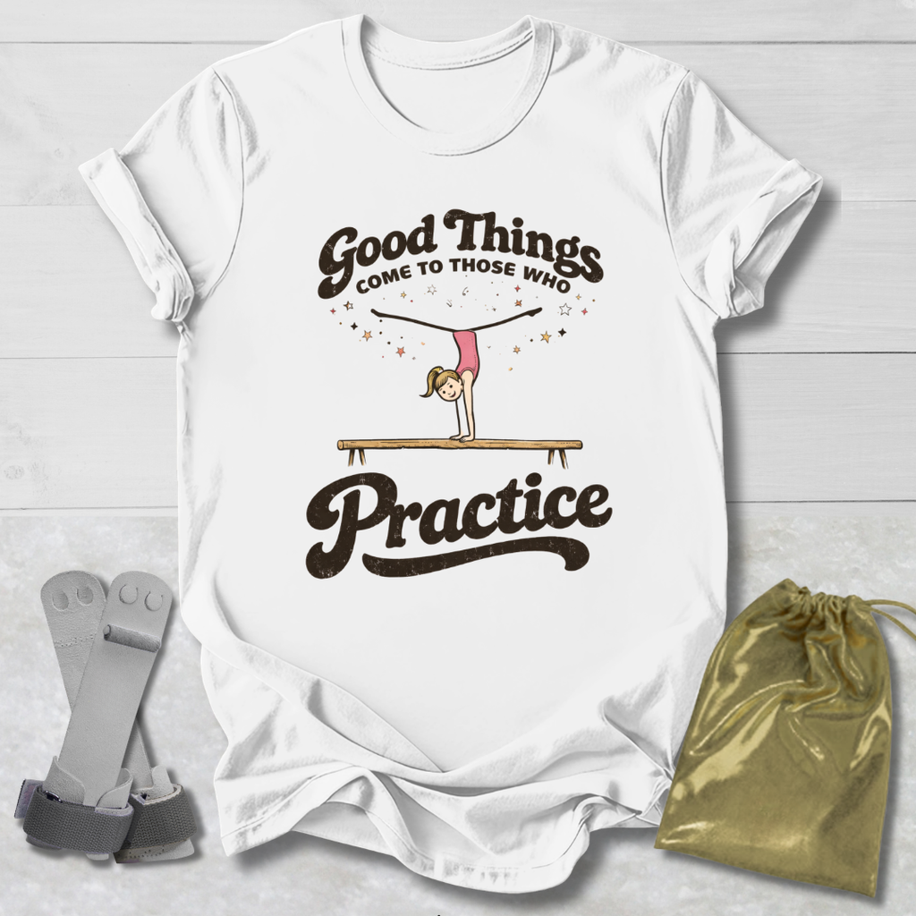 White t-shirt with 'Good Things Come to Those Who Practice' graphic on a wooden surface with socks and a drawstring bag.