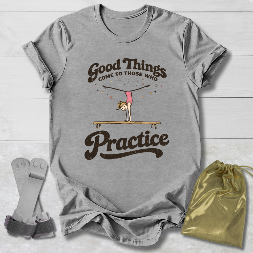 Gray t-shirt with motivational quote and graphic, socks, and drawstring bag on a wooden surface