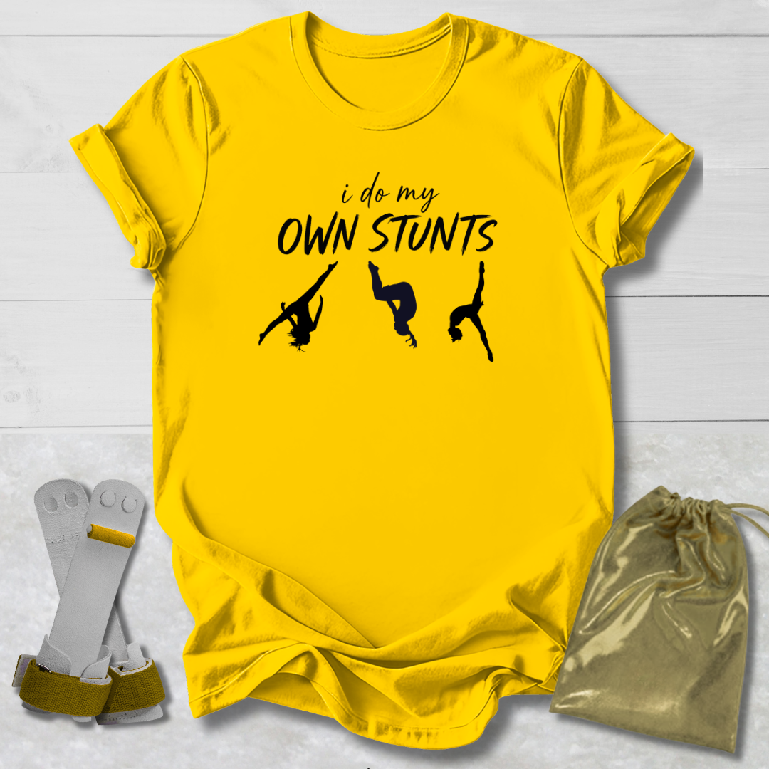 Yellow t-shirt with black text and silhouettes on a light gray background