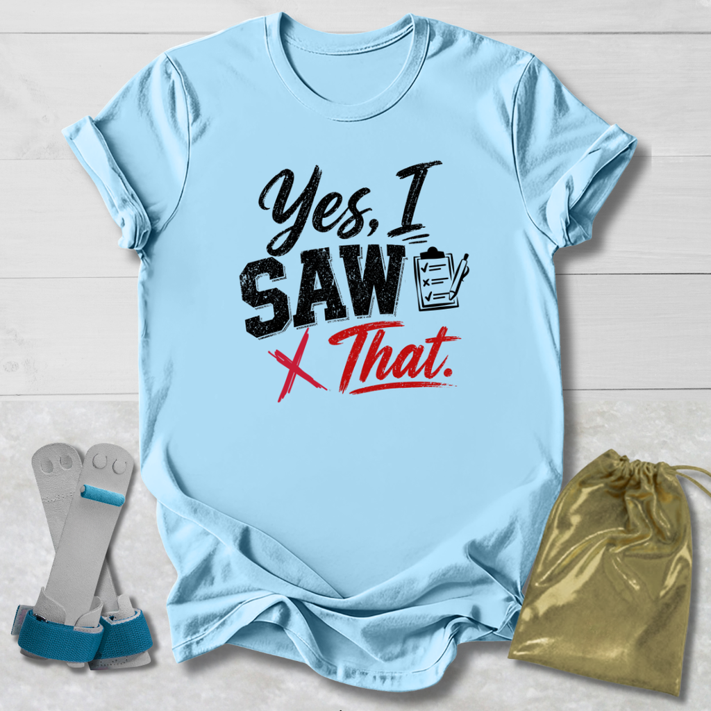 Light blue t-shirt with humorous text design on a wooden surface, accompanied by socks and a drawstring bag.