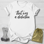 White t-shirt with 'That was a deduction' text, socks, and drawstring bag on a light wooden surface