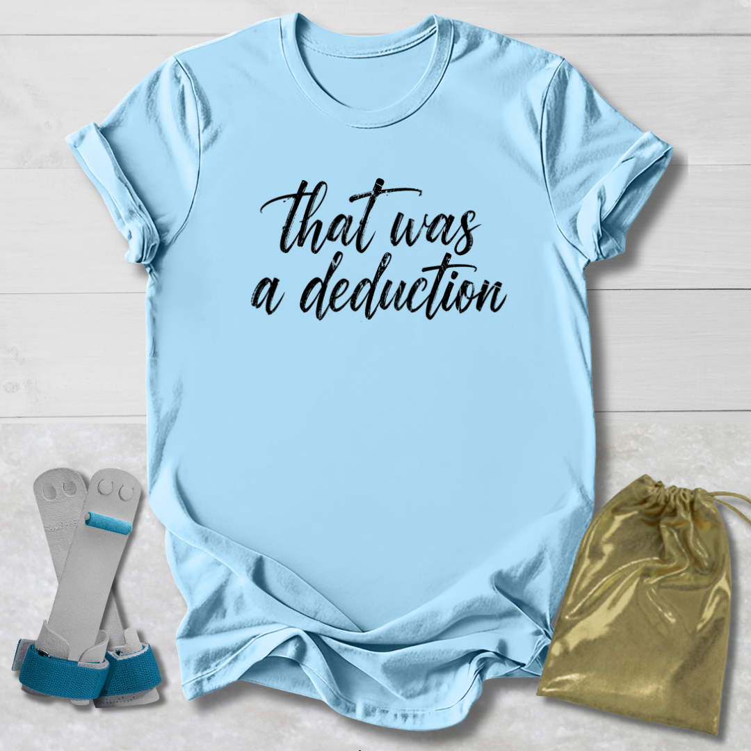 Light blue t-shirt with 'That was a deduction' text, socks, and drawstring bag on a light wooden surface