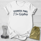 White t-shirt with gymnastics-themed graphic and text on a light wooden surface, accompanied by socks and a drawstring bag.