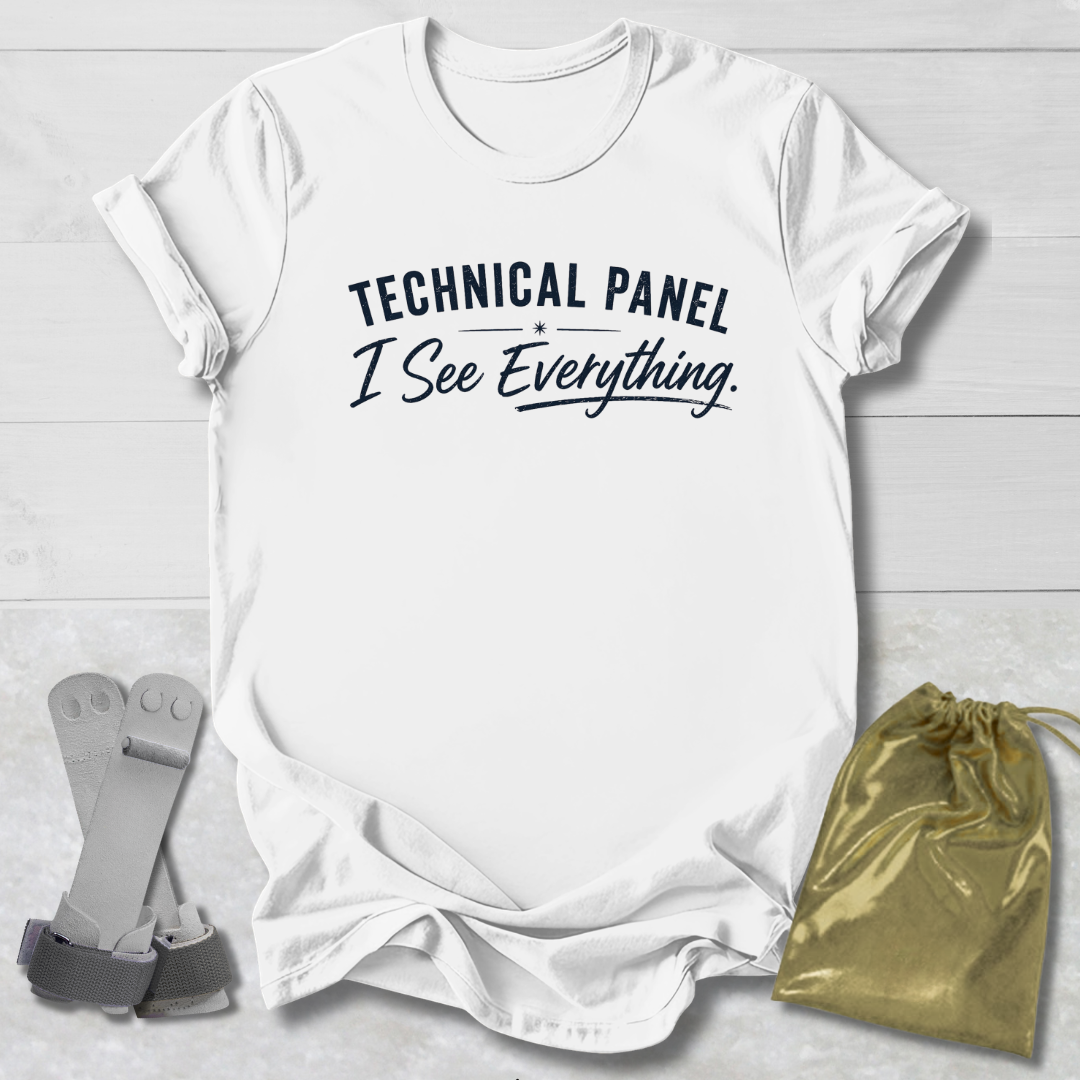 White t-shirt with gymnastics-themed graphic and text on a light wooden surface, accompanied by socks and a drawstring bag.