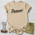 Beige t-shirt with 'Downgraded' text, socks, and drawstring bag on a light wooden surface
