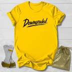 Yellow t-shirt with 'Downgraded' text, socks, and drawstring bag on a light wooden surface