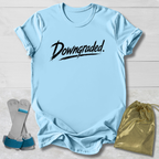 Light blue t-shirt with 'Downgraded' text, socks, and drawstring bag on a light wooden surface