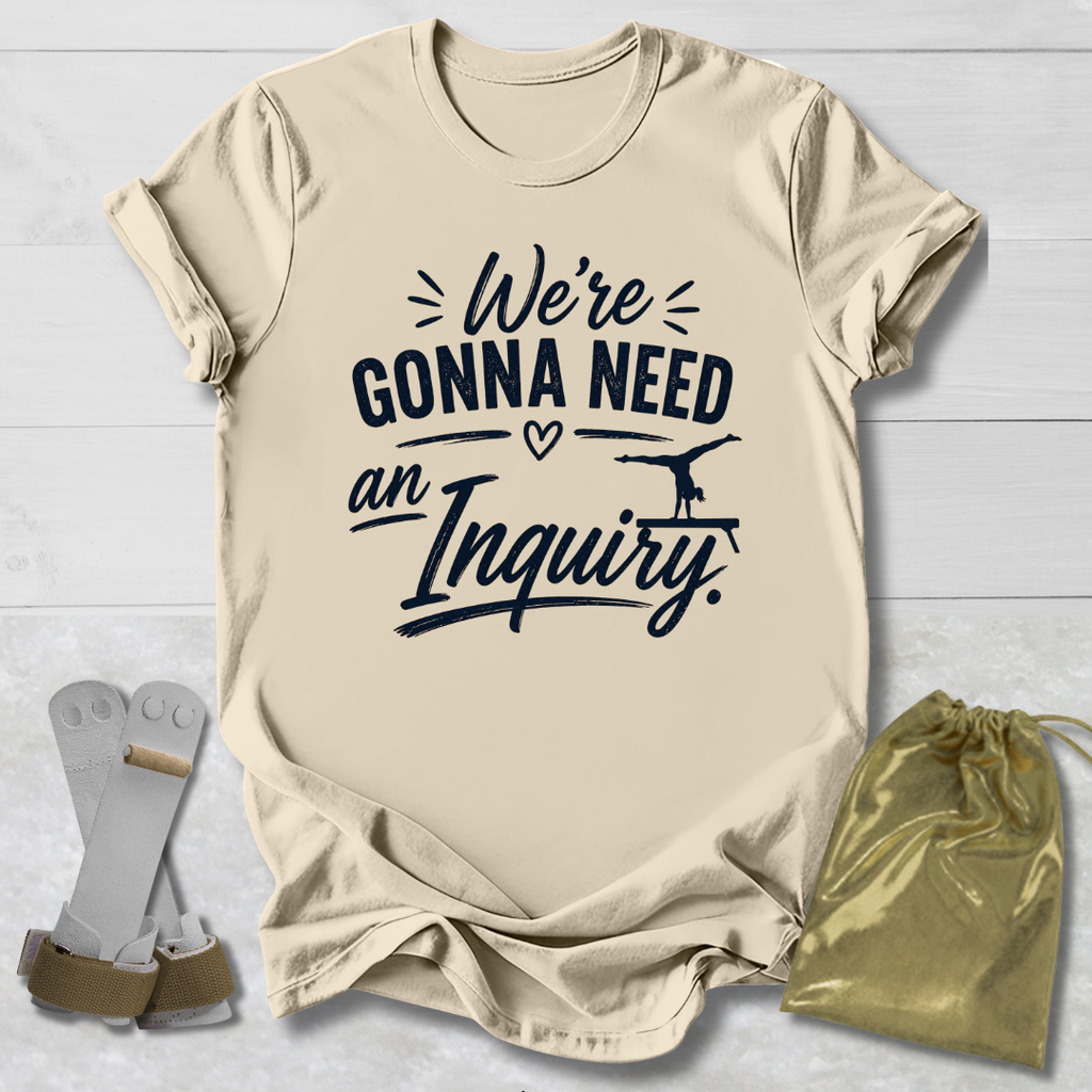 Beige t-shirt with humorous text design on a light wooden surface, accompanied by socks and a drawstring bag.