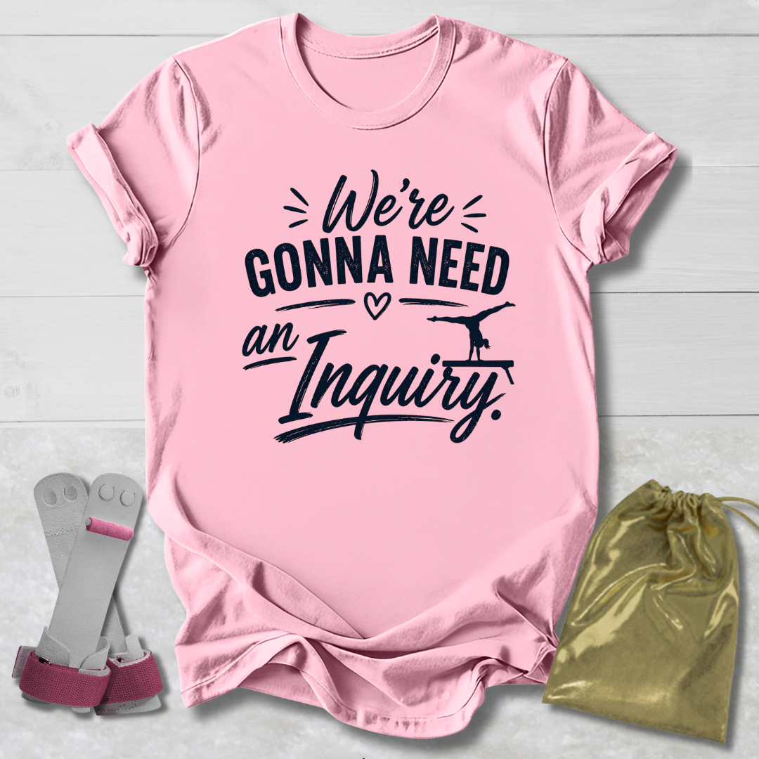 Pink t-shirt with text, socks, and drawstring bag on a light wooden surface