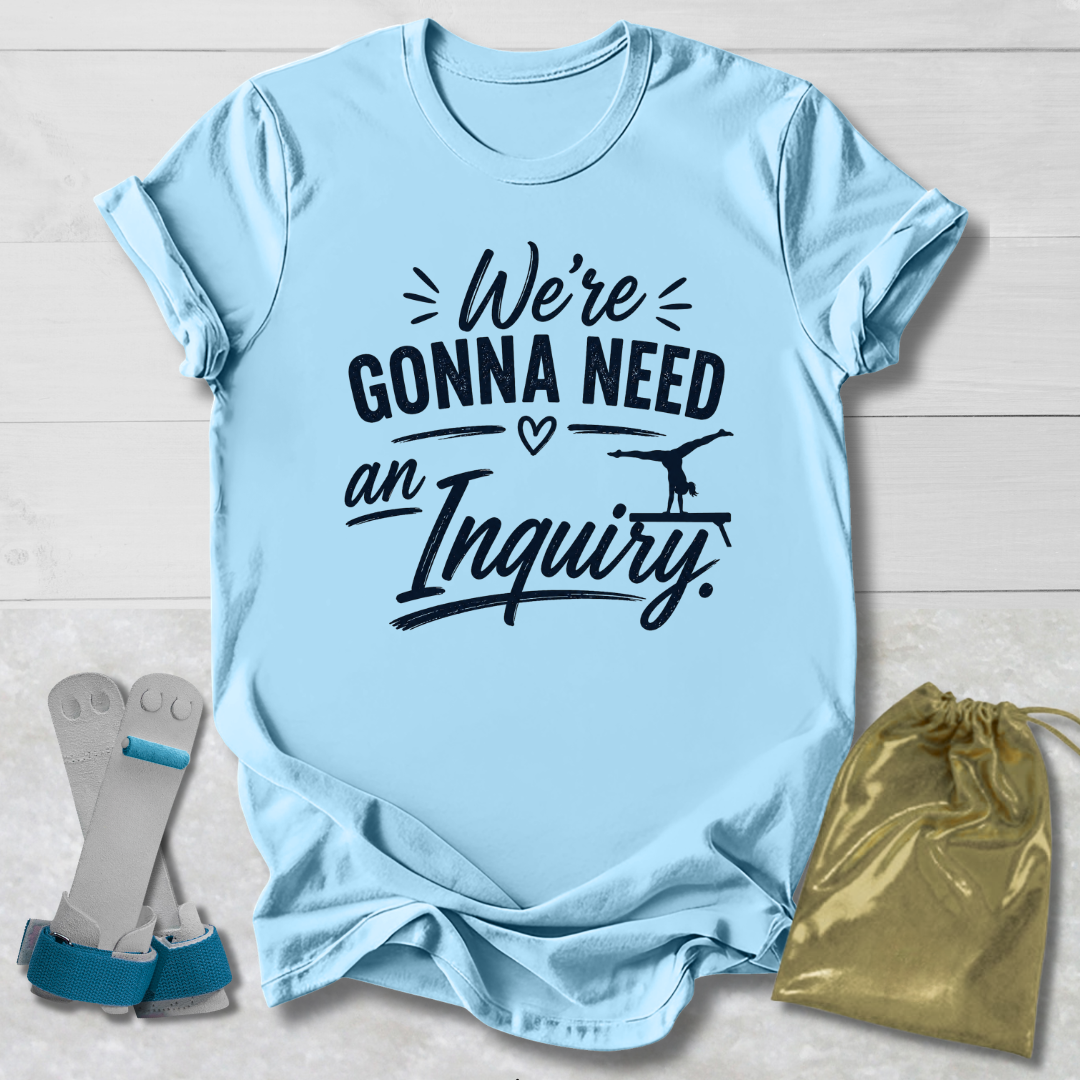 Light blue t-shirt with humorous text, socks, and drawstring bag on a light wooden surface