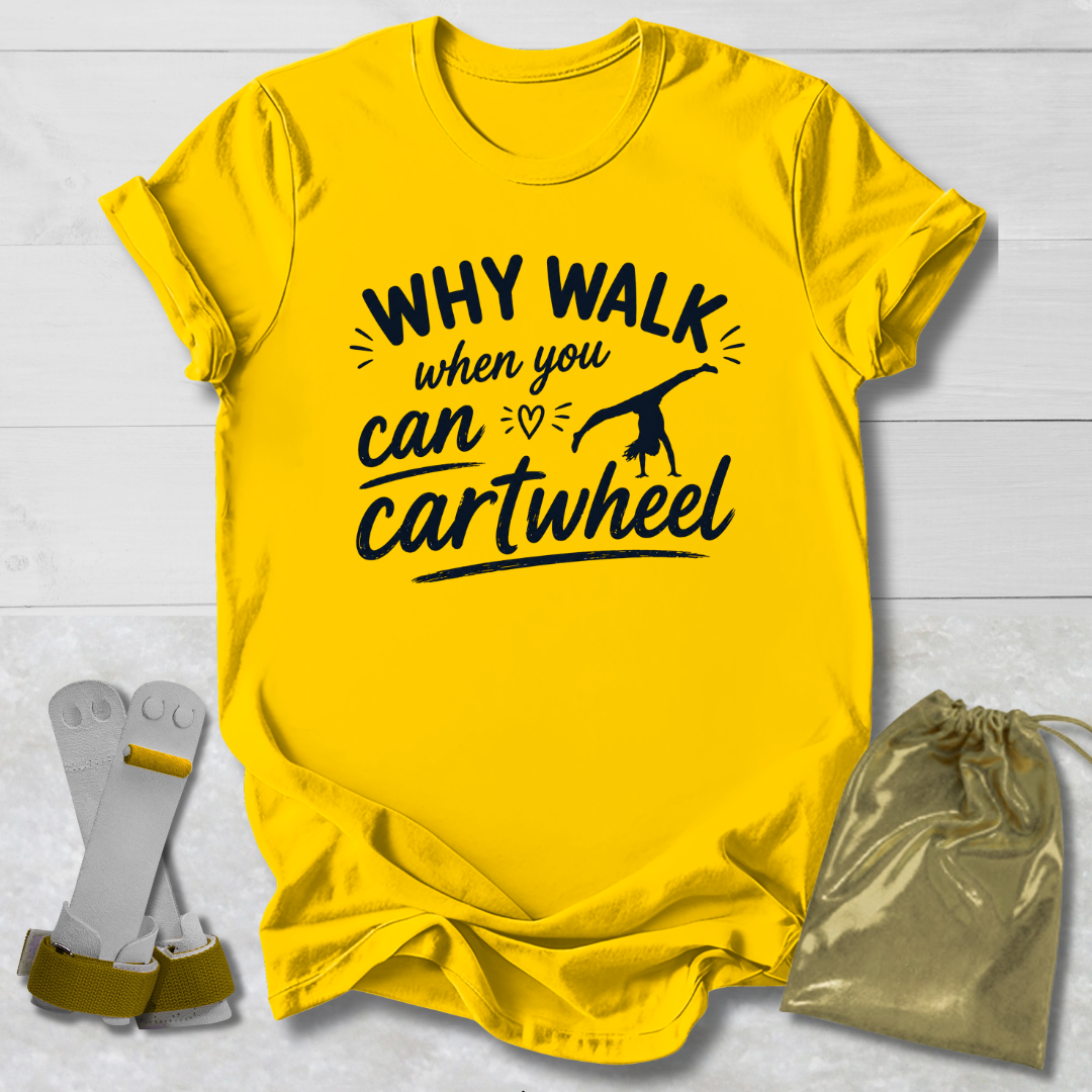 Yellow -shirt with 'Why walk when you can cartwheel' text, socks, and drawstring bag on a light wooden surface.