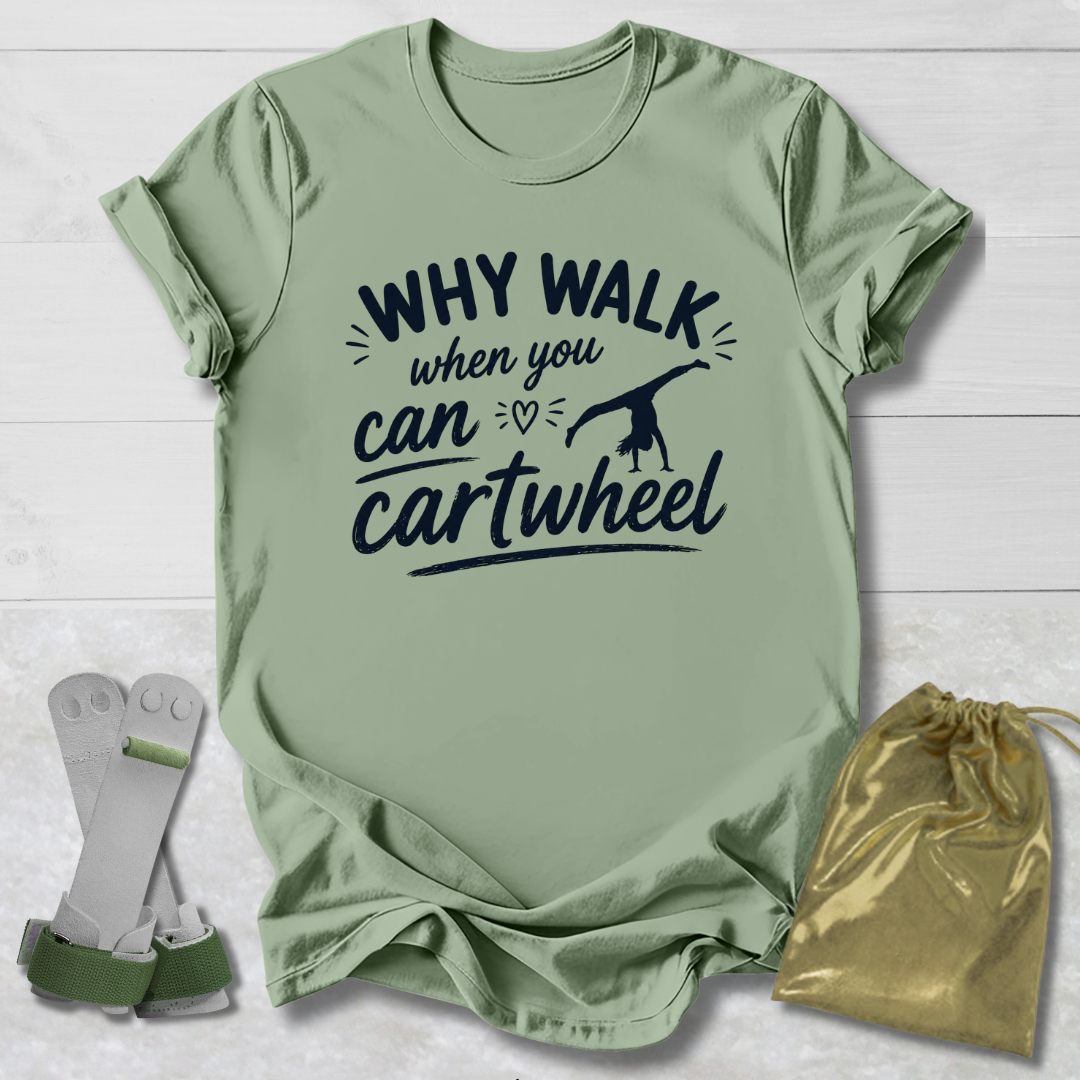 Green -shirt with 'Why walk when you can cartwheel' text, socks, and drawstring bag on a light wooden surface.